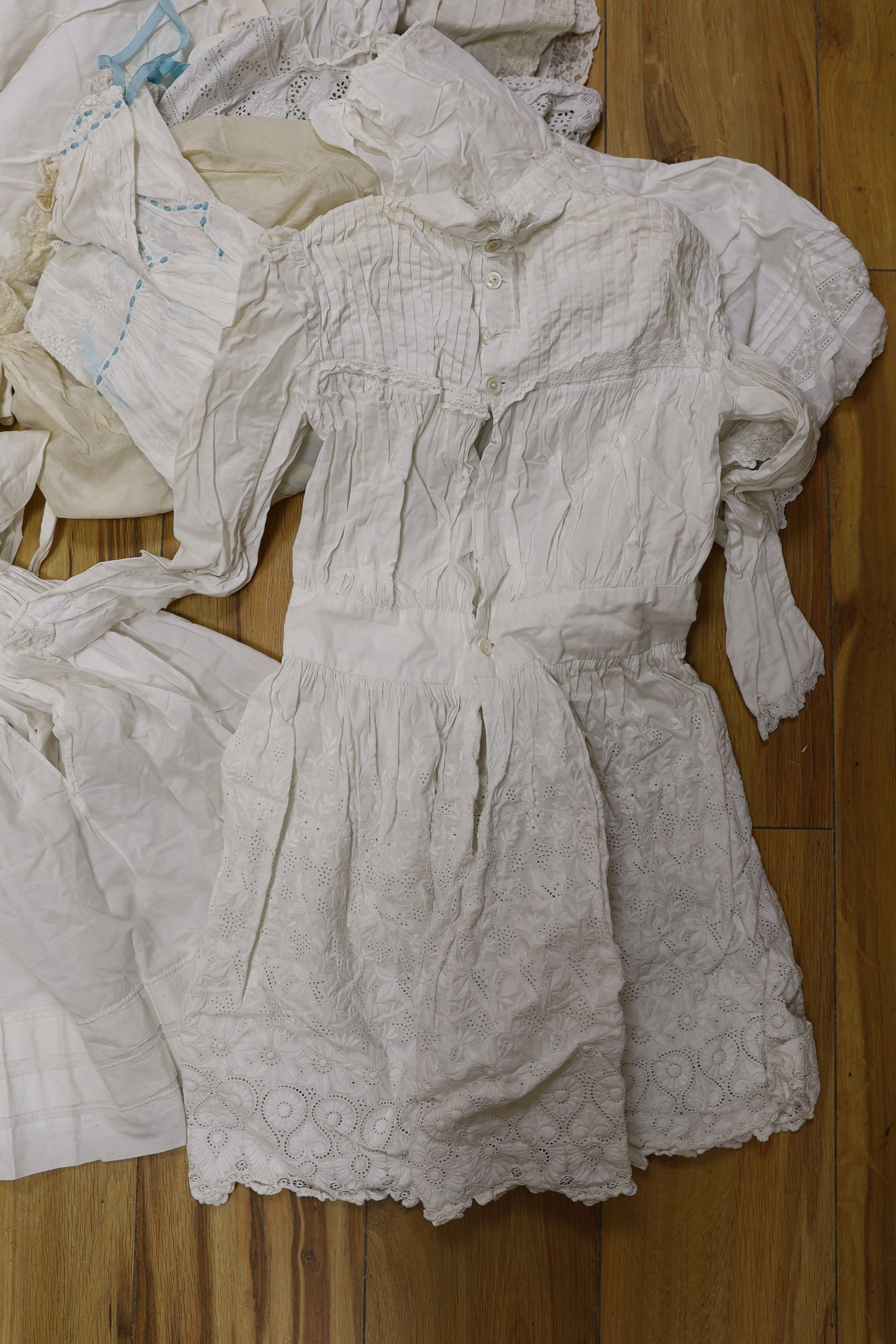 A collection of whiteworked baby gowns
